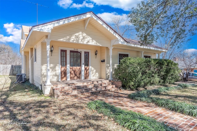 bungalow-style house with cooling unit and covered porch