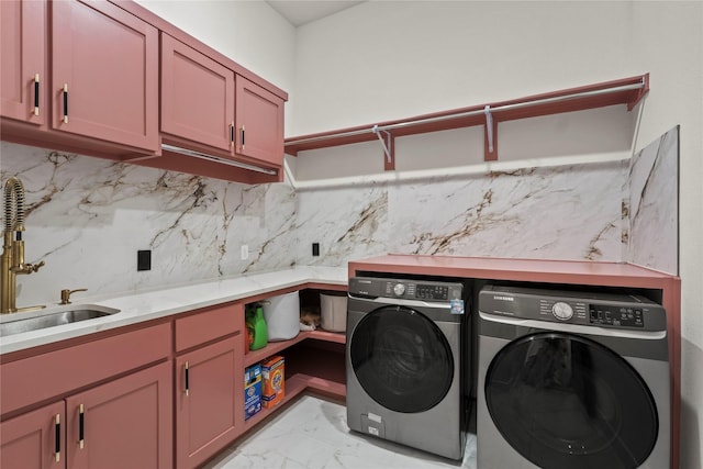 washroom with independent washer and dryer, cabinet space, a sink, and marble finish floor