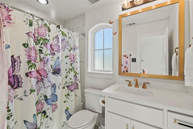 full bath with visible vents, toilet, vanity, and a shower with shower curtain