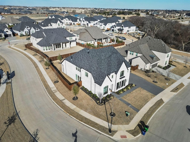 birds eye view of property with a residential view