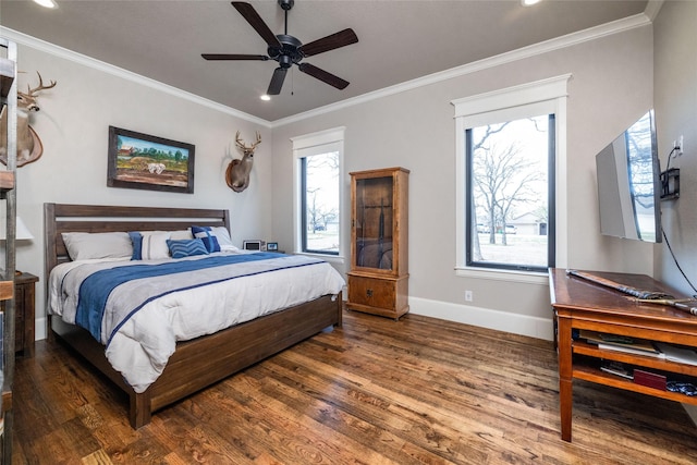 bedroom featuring ornamental molding, baseboards, and wood finished floors