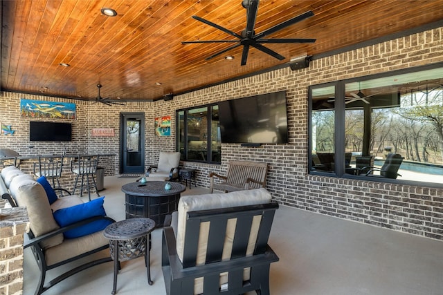 view of patio featuring ceiling fan and an outdoor living space