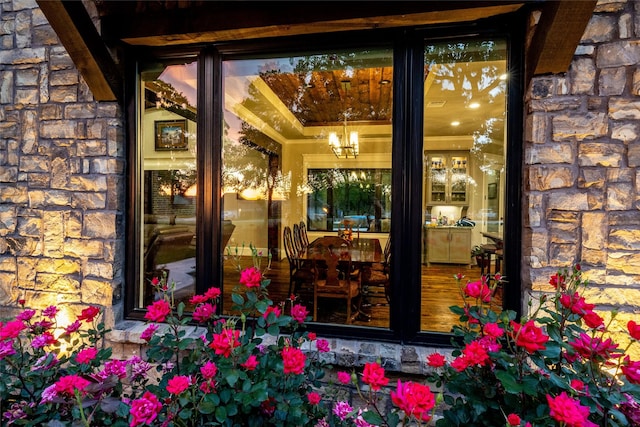 property entrance featuring stone siding