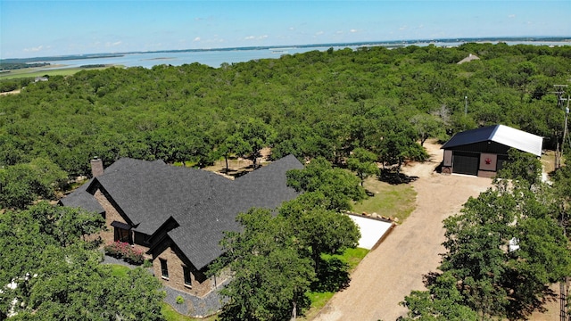 bird's eye view featuring a water view and a view of trees