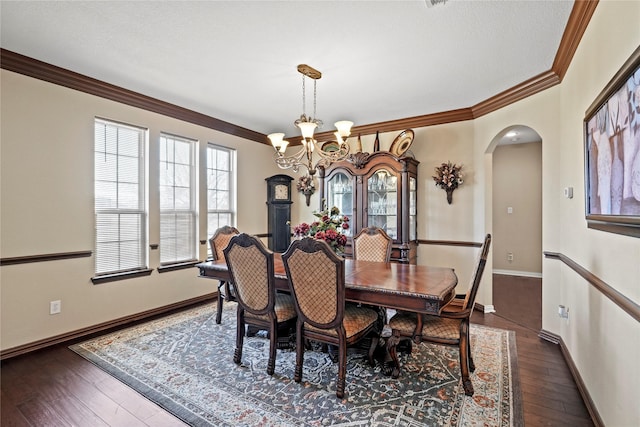 281 Crossbow Dr, Sunnyvale, TX 75182 - dining room featuring ornamental molding, arched walkways, a chandelier, and hardwood / wood-style floors
