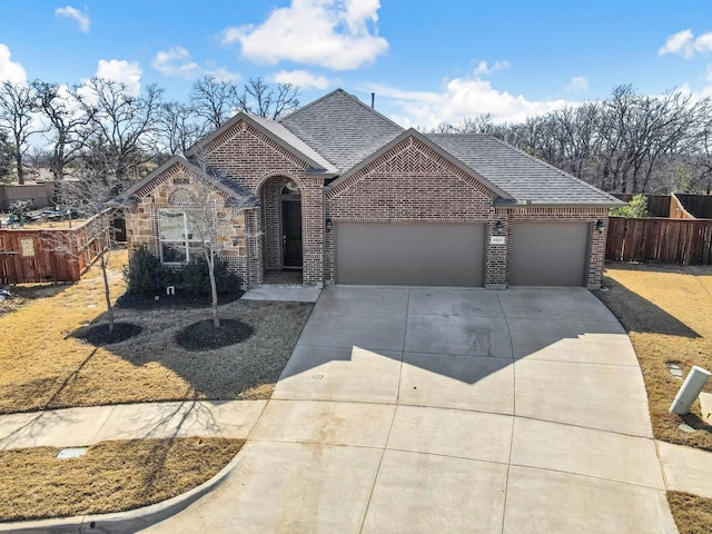 view of front facade featuring concrete driveway, brick siding, roof with shingles, and fence