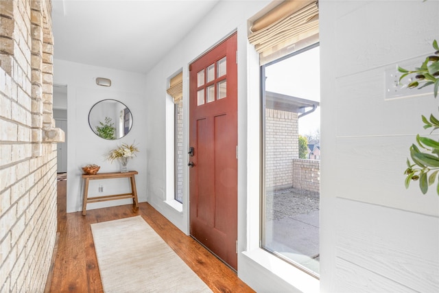 foyer entrance with wood finished floors