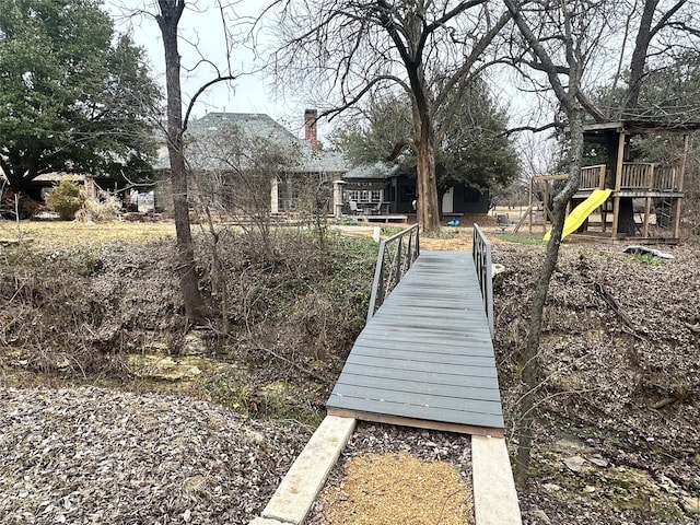 view of dock featuring playground community