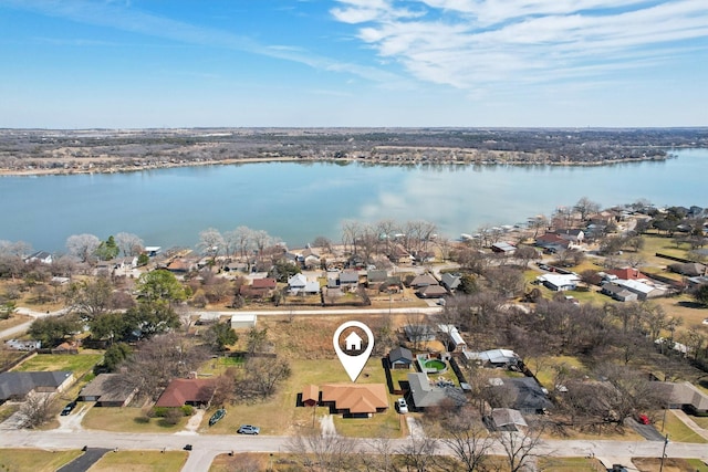 drone / aerial view with a residential view and a water view