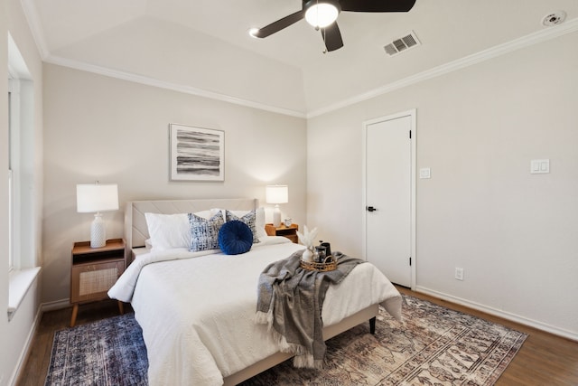 bedroom with wood finished floors, a ceiling fan, visible vents, baseboards, and ornamental molding