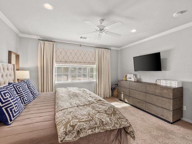 bedroom featuring ornamental molding, carpet, visible vents, and ceiling fan