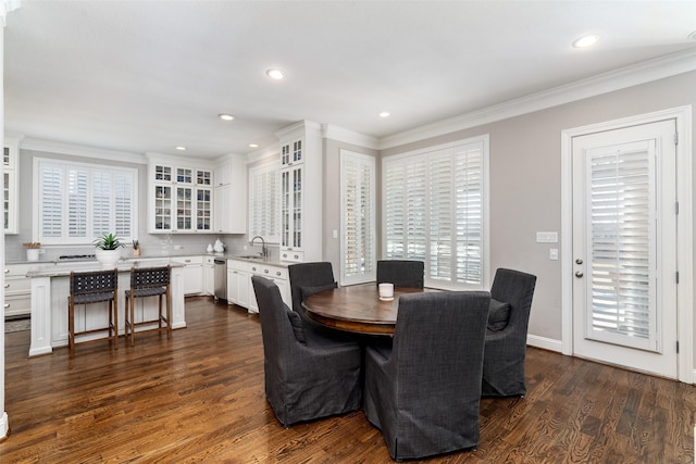 dining space featuring plenty of natural light, crown molding, dark wood-type flooring, and recessed lighting