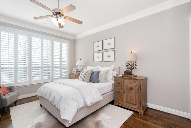 bedroom with baseboards, dark wood finished floors, a ceiling fan, and crown molding