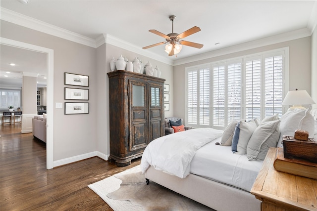 bedroom featuring baseboards, dark wood-type flooring, multiple windows, and crown molding