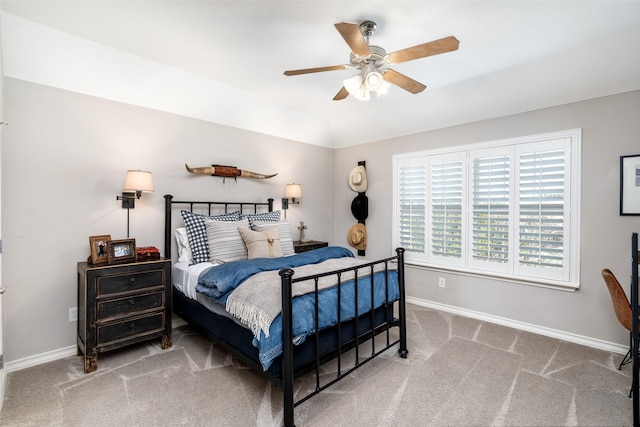 bedroom with ceiling fan, carpet floors, and baseboards