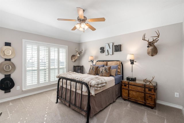 bedroom featuring ceiling fan, carpet floors, and baseboards