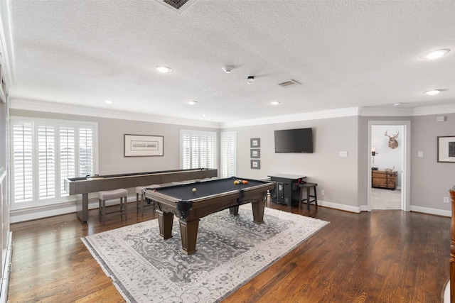 recreation room with baseboards, a textured ceiling, ornamental molding, and wood finished floors