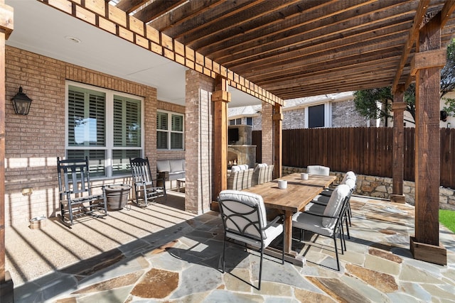 view of patio / terrace with outdoor dining area and fence