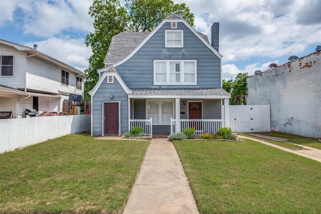 1009 Kings Hwy, Dallas, TX 75208 - view of front of house featuring roof with shingles, covered porch, and a chimney