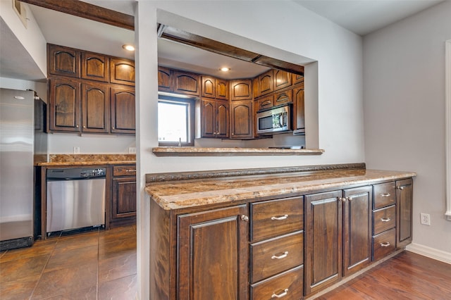 kitchen with stainless steel appliances and baseboards