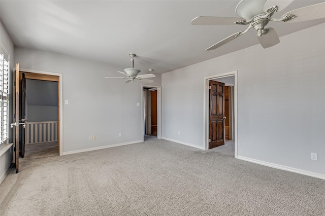 unfurnished room with light carpet, ceiling fan, and baseboards