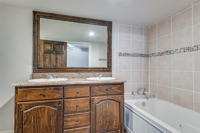 bathroom with double vanity, a sink, and a bathing tub