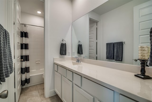 full bathroom with shower / bath combo, tile patterned flooring, and vanity