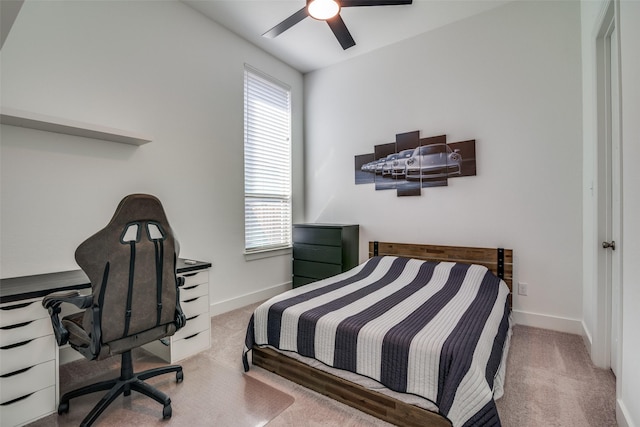 carpeted bedroom featuring ceiling fan and baseboards