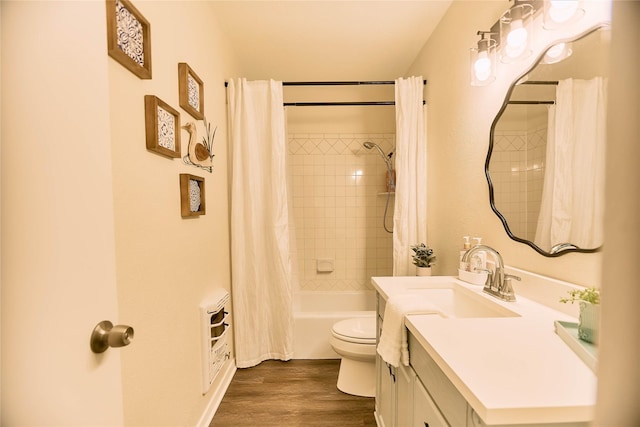 bathroom with shower / bath combination with curtain, vanity, toilet, and wood finished floors