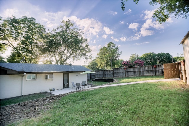 view of yard featuring fence and a patio