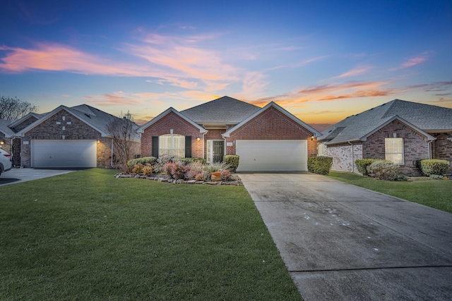 single story home with an attached garage, brick siding, a shingled roof, concrete driveway, and a front lawn