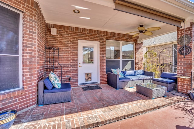 view of patio / terrace with an outdoor living space and a ceiling fan