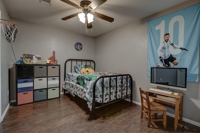 bedroom featuring a ceiling fan, visible vents, baseboards, and wood finished floors