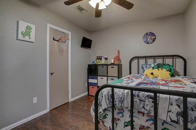 bedroom featuring a ceiling fan, baseboards, visible vents, and wood finished floors