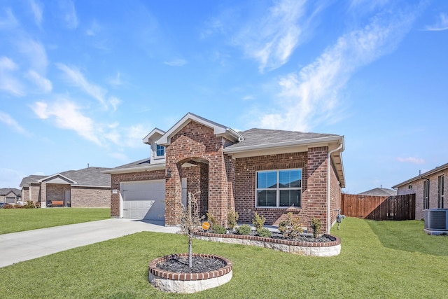 view of front of home with driveway, a front yard, fence, and brick siding