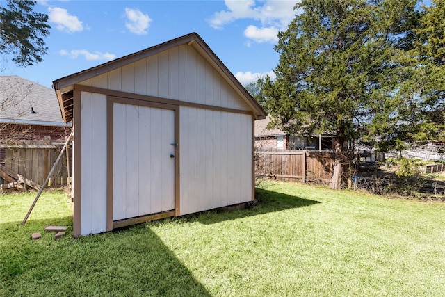 view of shed featuring fence private yard