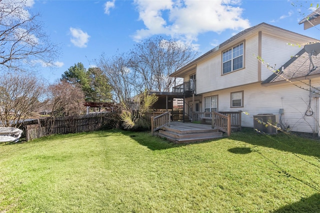 view of yard featuring a deck, stairway, fence, and central air condition unit