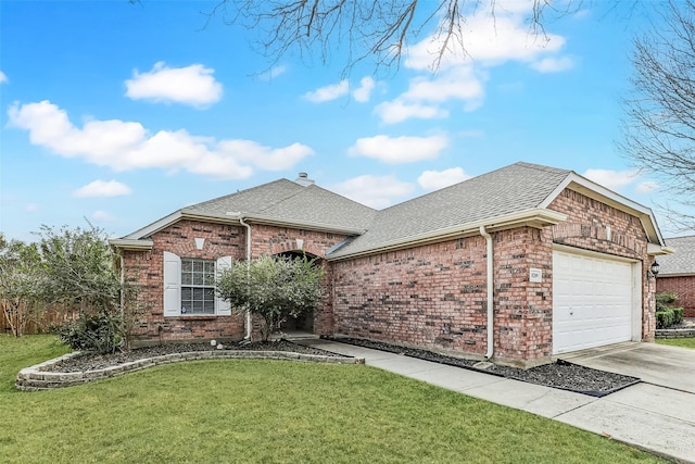 view of front facade featuring driveway, roof with shingles, a front lawn, and brick siding