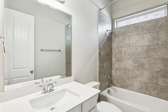 full bathroom featuring bathing tub / shower combination, toilet, and vanity