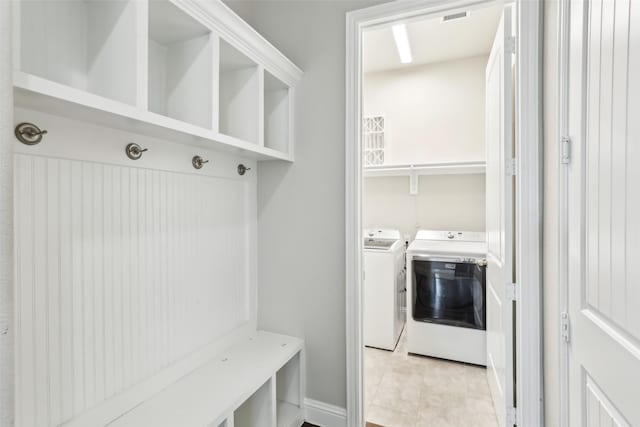 mudroom featuring washer and dryer