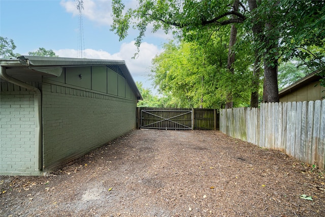 view of gate with fence