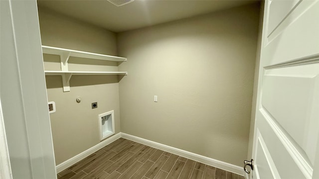 laundry area featuring laundry area, baseboards, hookup for an electric dryer, and wood finish floors