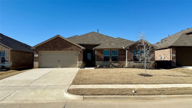 ranch-style home featuring a garage, brick siding, concrete driveway, stone siding, and roof with shingles