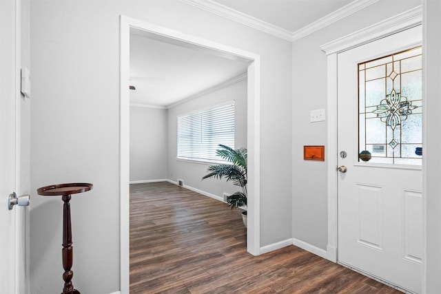 entryway with dark wood-type flooring, crown molding, and baseboards