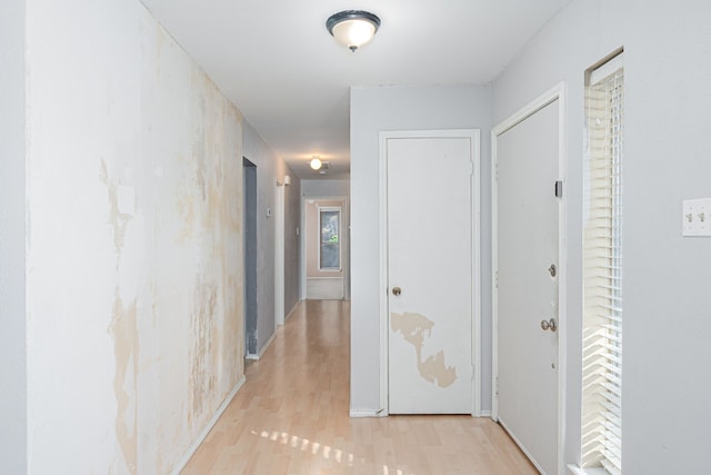 hallway with light wood-type flooring