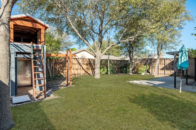 view of yard with a fenced backyard and a patio