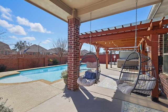 view of pool with a fenced in pool, a fenced backyard, and a patio