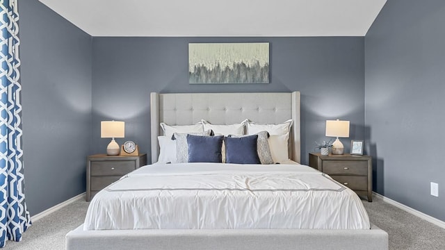 bedroom featuring carpet and baseboards