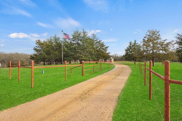 surrounding community with fence and a lawn