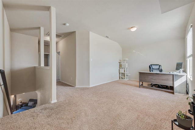 office with vaulted ceiling, carpet, visible vents, and baseboards